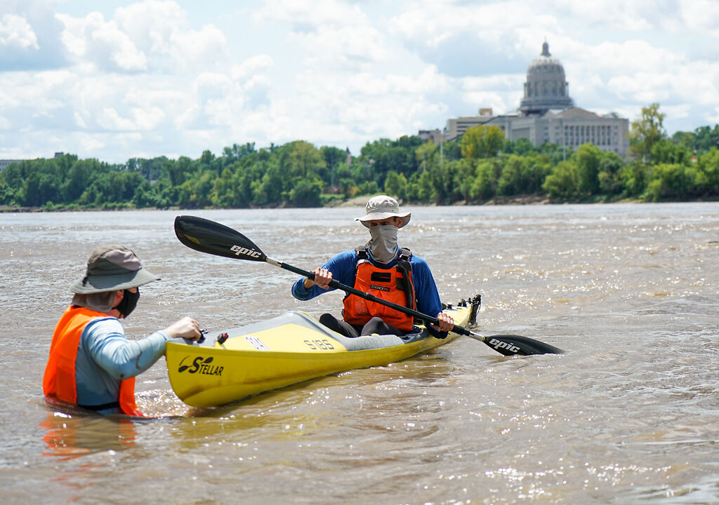 A solo paddler reaches the Jefferson City checkpoint
